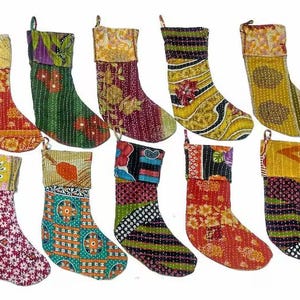 May include: Set of ten colourful Christmas stockings made from recycled fabric. Each stocking features a unique patchwork design with various patterns and colours.