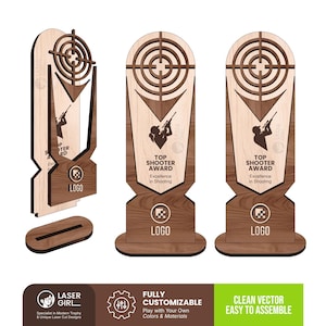 May include: A wooden trophy featuring a laser-cut target design at the top, a silhouette of a person aiming a rifle, and the text "TOP SHOOTER AWARD Excellence in Shooting" with a "LOGO" placeholder. The trophy includes a separate oval base.