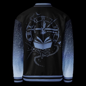 May include: Black bomber jacket with a blue and white starry gradient on the sleeves. The back features a blue illustration of an open book, clock, feather, and hand. The jacket has blue and black striped trim.