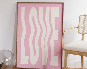 May include: A pink and white print with the word "LOVE" in a wavy, abstract font. The print is framed and hanging on a white wall.