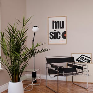 May include: A modern interior scene featuring a black and chrome chair, a floor lamp with a spherical light, and a potted plant. A framed poster with the word "music" and a vinyl record graphic hangs on the wall. The room has hardwood floors.