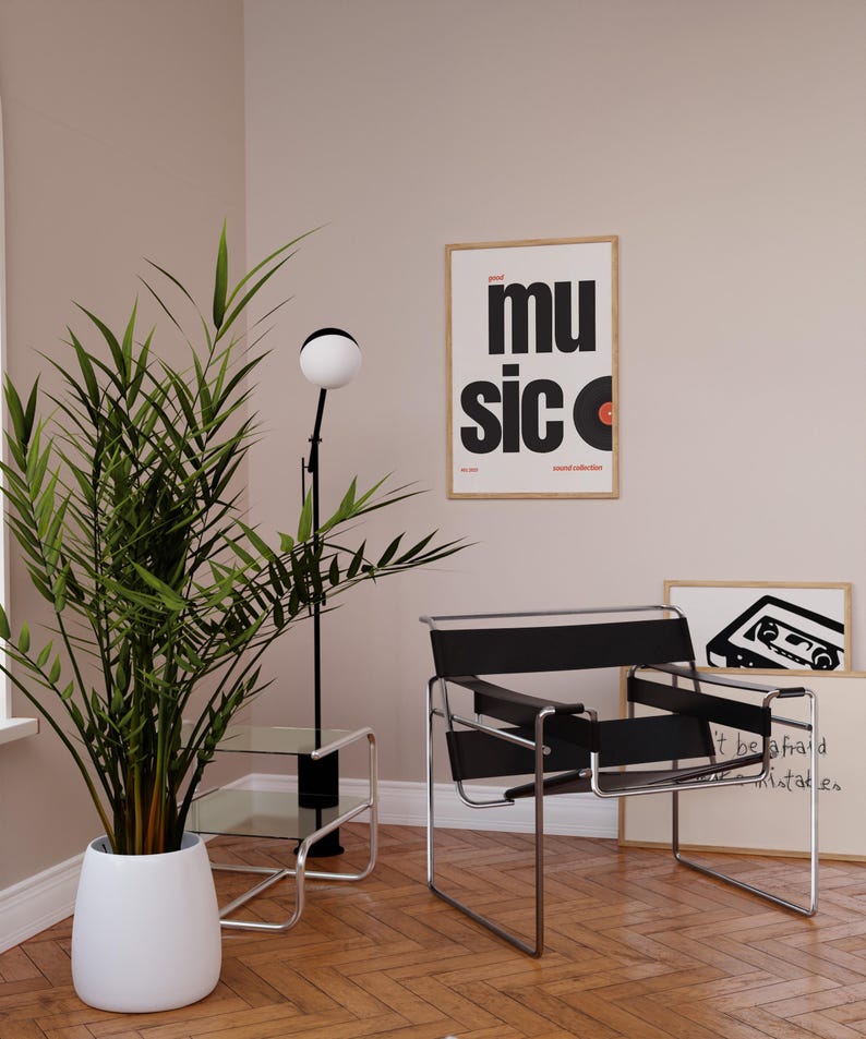May include: A modern interior scene featuring a black and chrome chair, a floor lamp with a spherical light, and a potted plant. A framed poster with the word "music" and a vinyl record graphic hangs on the wall. The room has hardwood floors.
