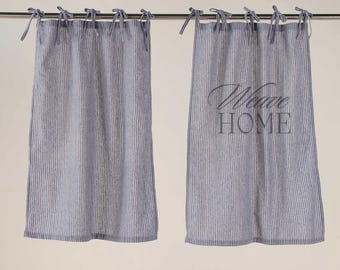 May include: A pair of blue and white striped kitchen curtains with a "My Home" inscription on the right curtain.