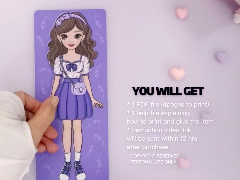 May include: A printable paper doll with a purple dress, white shirt, and a purple handbag. The doll is on a purple background with white flowers. The text "YOU WILL GET" is at the top of the image. The text below lists the items included in the purchase: 1 PDF file (4 pages to print), 1 help file explaining how to print and glue the item, and an instruction video link.