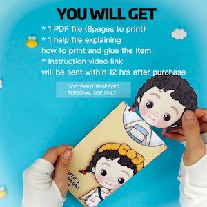 Op de afbeelding: Lichtblauwe achtergrond met de tekst "YOU WILL GET". De afbeelding toont een papieren pop met een beige envelop. De tekst op de envelop luidt "CUTIE'S DROBE". De afbeelding bevat ook bijen- en wolkenuitsparingen.