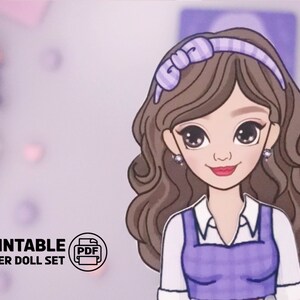 May include: Printable paper doll set featuring a girl with brown hair, wearing a purple and white dress and a purple headband with a bow. The text "Printable Paper Doll Set" is visible in the bottom left corner of the image.