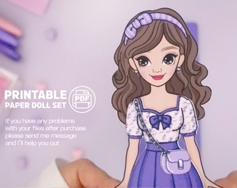 May include: Printable paper doll set with a girl wearing a purple dress, white floral blouse, and a purple purse. The doll has brown hair with a purple headband and blue eyes. The text "PRINTABLE PAPER DOLL SET" and "PDF" are visible in the image.