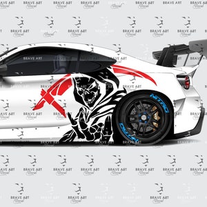 May include: White sports car with a black and red graphic design of a demon on the side. The car has black wheels with blue lettering and a black spoiler.