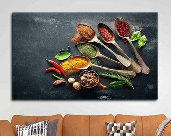 May include: A flat lay of various spices in silver spoons on a dark gray background. The spoons are arranged in a fan shape, with the handles pointing towards the top of the image. The spices include red pepper flakes, dried herbs, turmeric, and cinnamon. There are also fresh herbs, red chili peppers, and other spices scattered around the spoons.