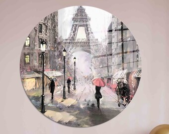 May include: A circular painting depicting a Parisian street scene with the Eiffel Tower in the background. The street is lined with lampposts and people walking with red umbrellas. The painting is done in a painterly style with a soft, muted color palette.