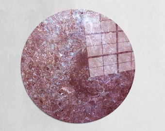 May include: A round, circular wall decor with a marbled pattern in shades of brown, pink, and white. The marbling creates a unique and abstract design.