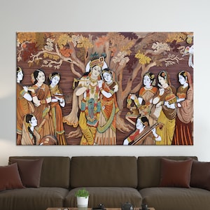 May include: A colorful wood carving depicting a scene from Hindu mythology. The carving features multiple figures, including Krishna and Radha, surrounded by trees and flowers. The carving is painted in vibrant colors and has a detailed, intricate design.