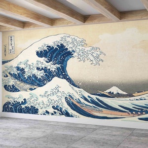 May include: A large wave with a mountain in the background. The wave is blue and white and has a traditional Japanese design. The mountain is white and has a peak.