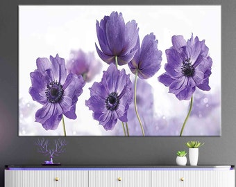 May include: A canvas print featuring a close-up of five purple flowers with white centers and a soft, blurred background.