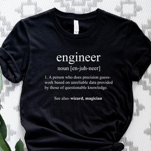 May include: Black t-shirt with a white graphic that says "engineer" and defines the word as "a person who does precision guess-work based on unreliable data provided by those of questionable knowledge." The graphic also says "See also: wizard, magician."