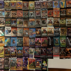May include: A large collection of sealed trading card game booster packs. The packs are arranged in rows and columns, displaying various colorful artwork and titles. The image showcases a variety of sets, with different art styles and themes.