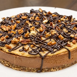 Vegan Turtle  Cheesecake, Delicious Pound Cashew Cheese Cake with Walnut Crust Sweet Medjool Dates Caramel Raw Chocolate Covered Sauce, Raw