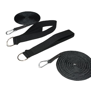 May include: Black nylon straps and rope with metal D-rings and carabiner clips. The image shows two coiled ropes and two straps with D-rings, and one strap with a carabiner clip. The items are set against a white background.