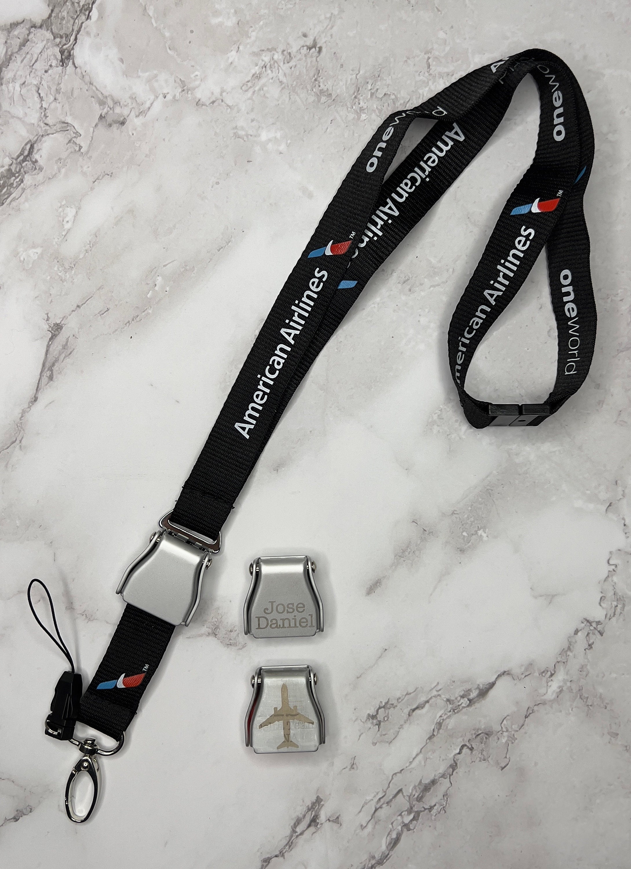 Lanière avec boucle de ceinture de sécurité American Airlines AA