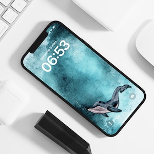 May include: A blue and green watercolor phone background with a whale illustration. The phone screen displays the time 06:53 and the date Dimanche 3 mars.