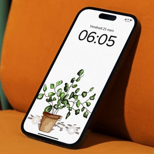 May include: A black smartphone with a white screen displaying a digital clock showing 06:05 and the date "Vendredi 21 mars". The background image is a watercolor illustration of a potted plant with green leaves.