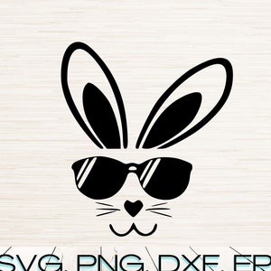May include: Black and white graphic of a bunny face wearing sunglasses. The bunny has long ears, a heart-shaped nose, and whiskers. Text at the bottom reads: SVG, PNG, DXF, EPS, JPG, PDF.