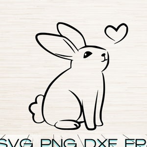 May include: A black and white line drawing of a rabbit sitting with its ears up and looking to the right. The rabbit has a heart above its head.