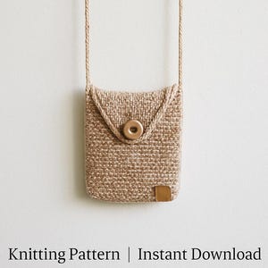 May include: A beige knitted phone case with a flap closure and a button. The case has a woven texture and a small leather patch on the bottom. The case hangs from a matching beige cord. The text "Knitting Pattern | Instant Download" is at the bottom.