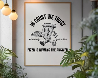 May include: A framed print with a black and white illustration of a pizza slice with legs and arms. The pizza slice is holding a pizza box. The text on the print reads "In Crust We Trust", "Hot & Ready", "Grab a Slice", and "Pizza is Always the Answer".
