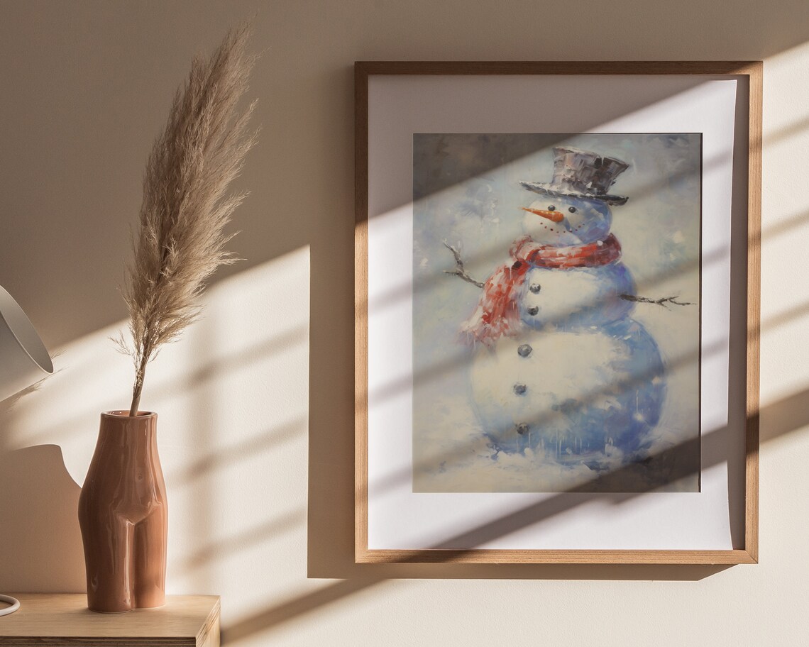 The Finishing Touch on the Snowman Framed Wall Art by Jo Moulton
