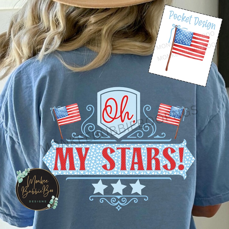 May include: A blue t-shirt with a red, white, and blue patriotic design. The design features two American flags, a banner that says "Oh My Stars!" and three stars. The shirt is perfect for celebrating Independence Day or showing your American pride.