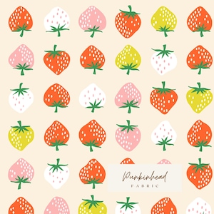 May include: A repeating pattern of stylized strawberries in various colors, including red, pink, white, and yellow, with green stems and leaves. The strawberries are set against a cream-colored background. The text "Punkinhead Fabric" is in a white rectangle.