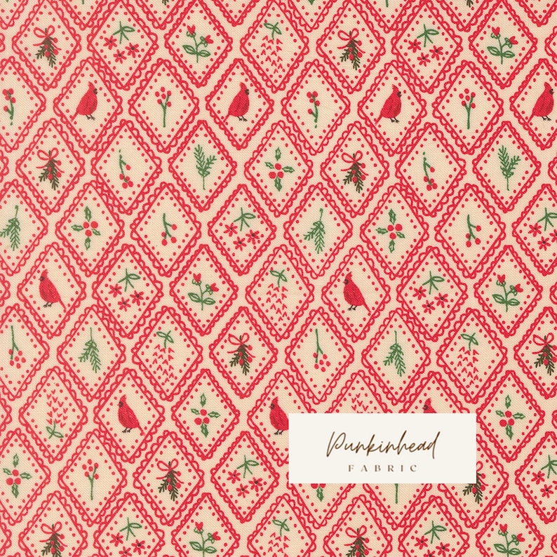 May include: A cream-colored fabric featuring a repeating diamond pattern outlined in red. Inside each diamond are small illustrations of red cardinals, green pine sprigs, red berries, and flowers. A white rectangular label reads Punkinhead FABRIC.