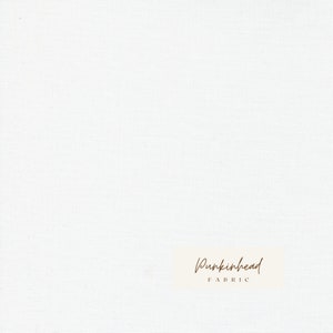 May include: White fabric with a subtle texture. The fabric has a small label with the text "Pumpkinhead Fabric" in brown script.