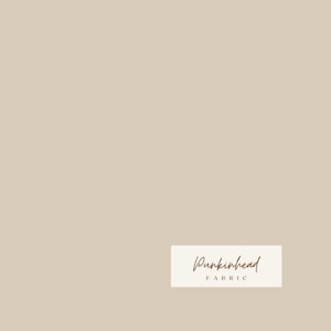 May include: A solid beige fabric swatch with the text "Pumpkinhead Fabric" printed on a white label.