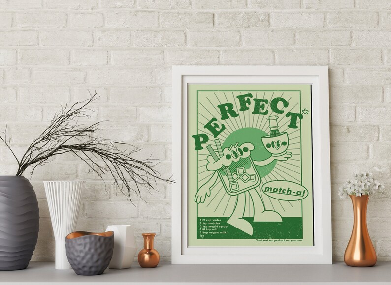 May include: A framed art print with a retro cartoon design in shades of green. The artwork features a character holding a matcha drink, with the word "PERFECT" above. The recipe is listed below the character.
