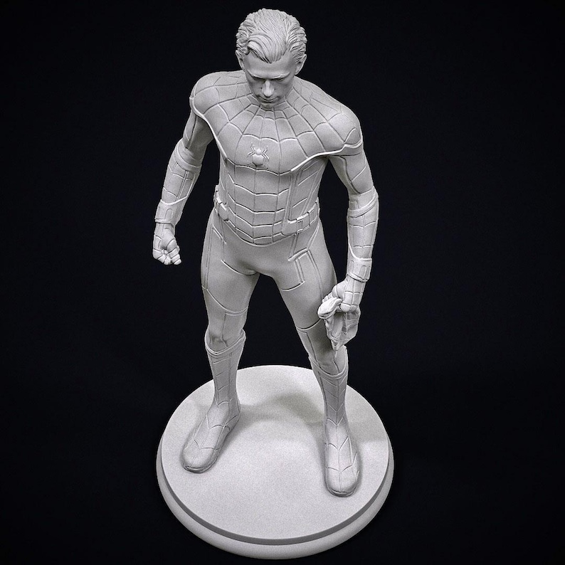 May include: A gray, three-dimensional statue of a superhero in a form-fitting suit, standing on a circular base. The figure is in a dynamic pose, holding a web-like accessory. The statue is detailed with textured panels and a spider emblem on the chest.