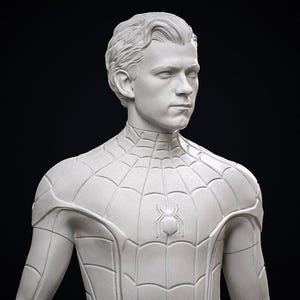 May include: A white bust of a person with short, styled hair, wearing a Spider-Man suit. The suit features a web pattern and a spider emblem on the chest. The background is black.