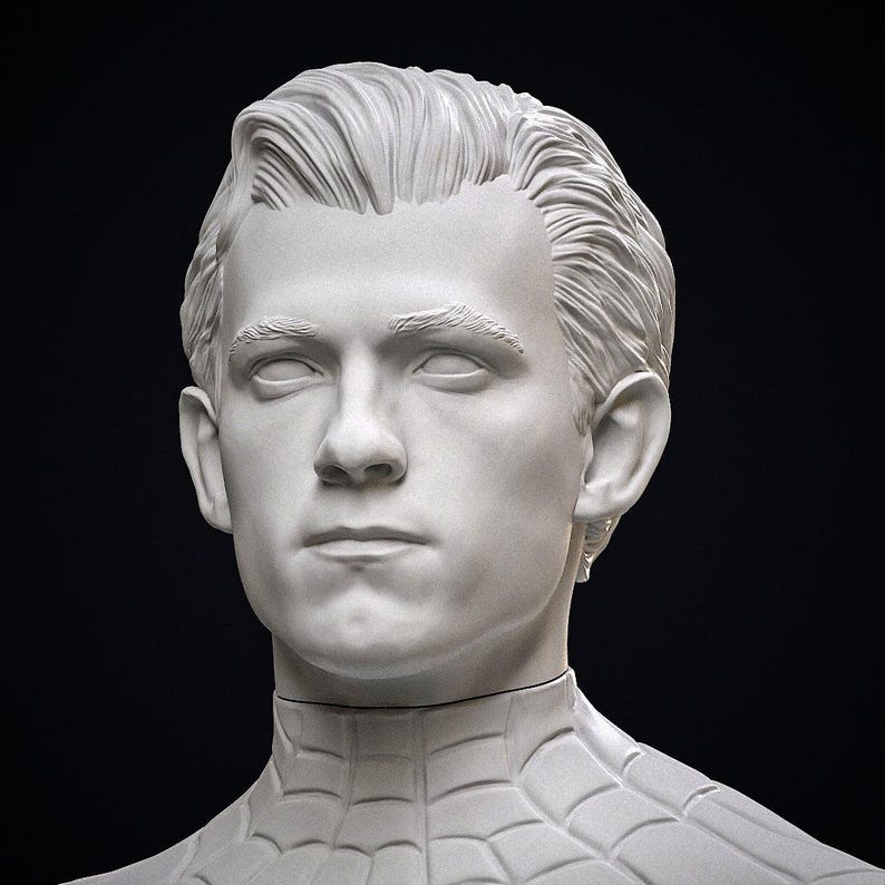 May include: A white bust of a man with short, styled hair and a serious expression. The bust is of a superhero, with the costume's webbed pattern visible on the shoulders and chest. The background is black.