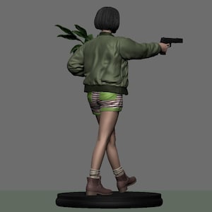 May include: A figurine of a person in a green bomber jacket, striped shorts, and boots, holding a handgun and a plant. The figure has short black hair and is standing on a black circular base. The background is a solid gray.
