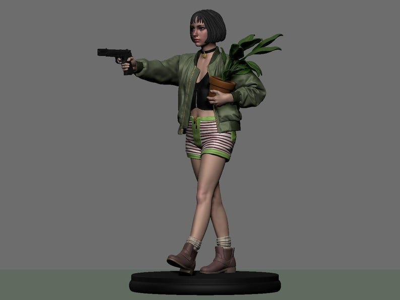 May include: A figurine of a character holding a handgun and a potted plant. The figure wears a green bomber jacket, black top, striped shorts, and brown boots. The figure is standing on a black circular base.