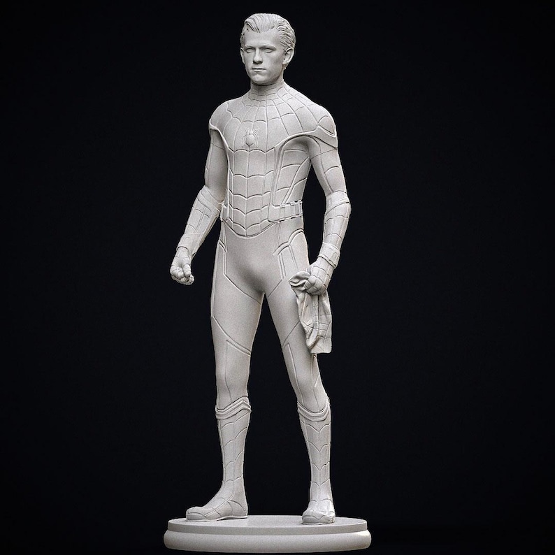 May include: A white statue of a superhero in a form-fitting suit with web-like detailing. The figure is standing on a circular base, holding a mask or cloth in one hand. The background is solid black.