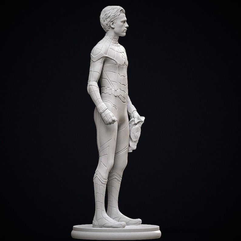 May include: A gray statue of a superhero in a form-fitting suit, holding a mask. The figure stands on a circular base against a black background. The statue is detailed, showing the suit's design and the character's features.