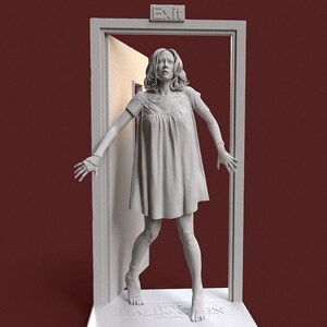 May include: A gray sculpture of a woman in a short dress, standing in a doorway with the word "Exit" above. The woman has her arms outstretched, and the word "Halloween" is at the base of the doorway.