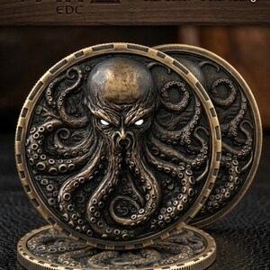 May include: A circular bronze-toned coin featuring a high-relief octopus design with glowing white eyes and intricate tentacles. The coin has a textured, dark finish and a ridged edge. Text on the image includes ODIN EDC, Instant download - PNG, and Star Seller - 5 star rating.