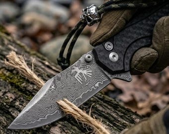 67 layer VG10 damascus blade. Carbon fiber dual layer scales. EDC knife. Button lock. Lanyard with predator bead. Odin approved
