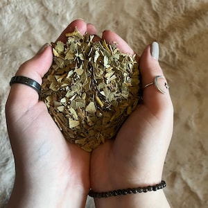 May include: A handful of dried green and brown yerba mate leaves.