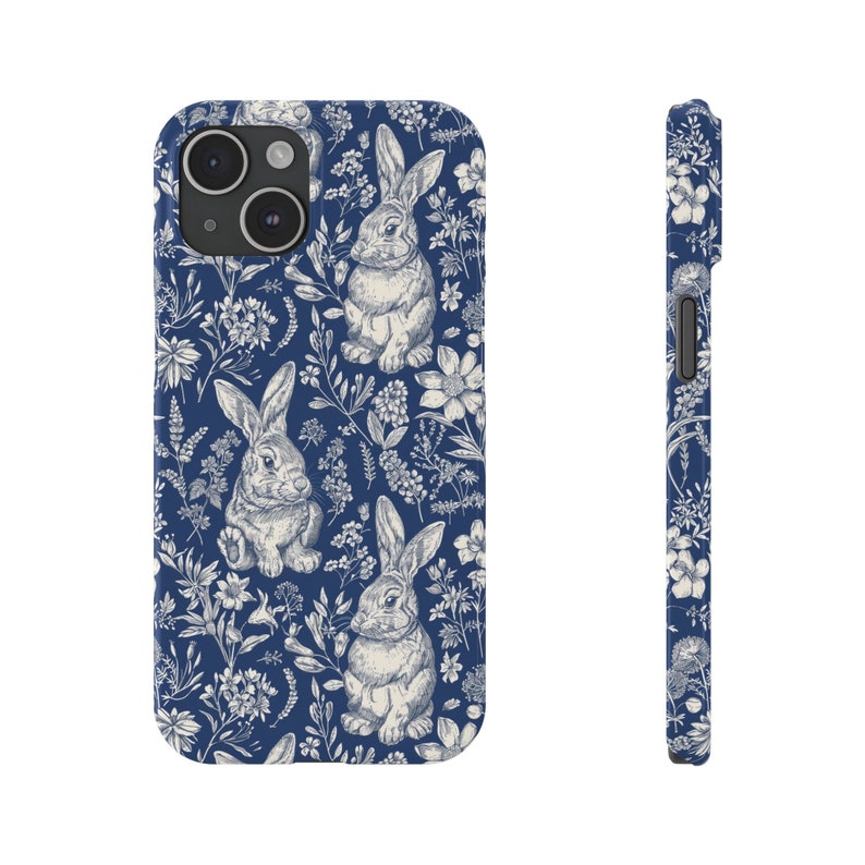 May include: A blue phone case with a white rabbit and floral pattern.