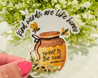 May include: A white sticker with a honey jar, bees, and the text "Kind words are like honey sweet to the soul Proverbs 16:24".