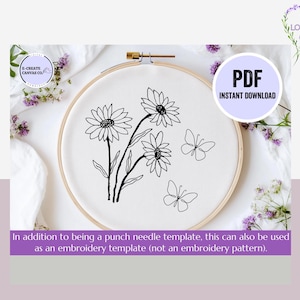 May include: A black and white line art design of daisies and butterflies on a white embroidery hoop. The design is a punch needle template and can also be used as an embroidery template.